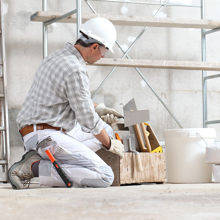 Man construction worker work with tool box wear gloves